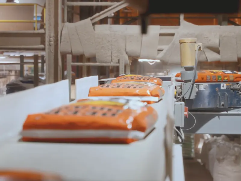 Filled feed bags moving through the production line